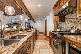The beautifully appointed kitchen in Abode on Doe Pass.