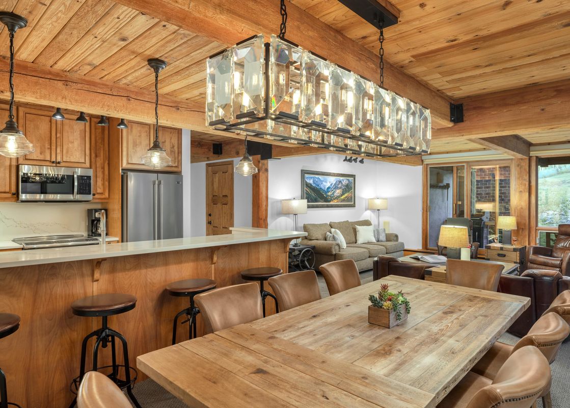 The open concept living area at Top of the Village Trails 109 with a kitchen, dining area, and living room.