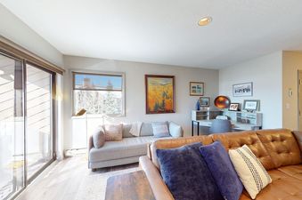 Bright and inviting living room in La Casa 04 featuring comfortable seating and natural light.