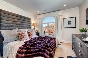 Comfort and style combine in this bedroom at Abode at Sky Silver Edge.