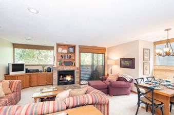 Living area at Telluride Lodge 532 with fireplace.