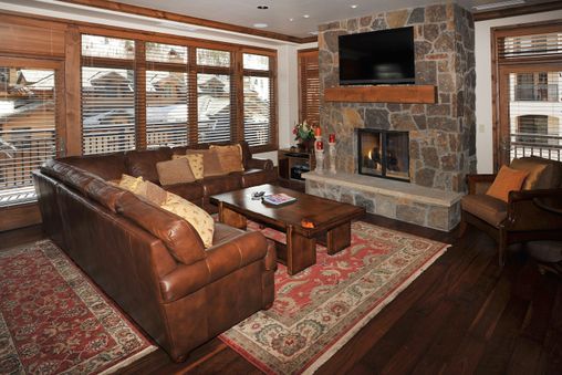 Moss rock gas fireplace in living room