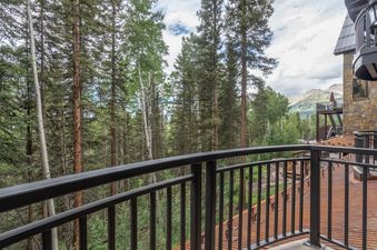 A view of the forest and mountains from Bear Creek Lodge 202's balcony.