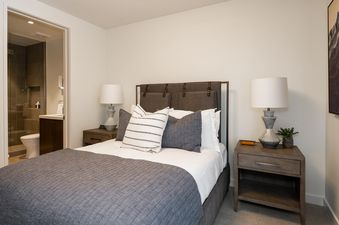 The master bedroom at Moonlight Basin 5 Thistle Way features a plush king-size bed, bedside tables, and a large window.