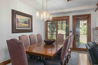 The dining room at Shooting Star 106 is well-lit and perfect for a large family meal.
