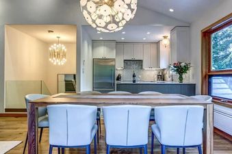The kitchen and dining area in Cedar Hollow 12 are well-lit and modern.