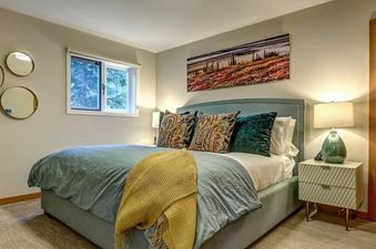 Comfortable bedroom at Cedar Hollow 12 with blue bedding and decorative pillows.