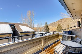 Chatham Crossing 2198 has a private deck with a table and chairs, a gas grill, and a view of the snow-capped mountains.