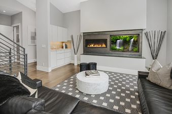 Living room with fireplace and waterfall display.