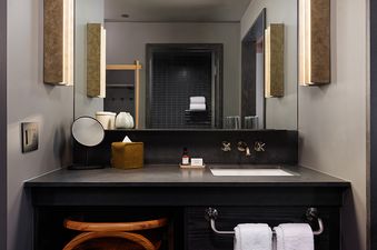 The well-appointed bathroom in Mollie Aspen Smuggler Double Queen features modern fixtures and a sleek design.