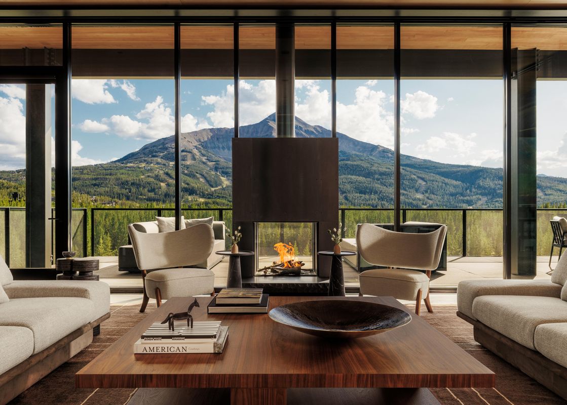 Big Sky Suite living area with fireplace and mountain view
