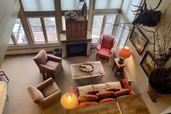 An interior shot of Shirana 7, showcasing its cozy living space with comfortable seating and natural light.