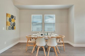 Dining room of Mayflower Lakeside 9975 with table set for six.