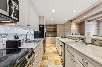 A modern and fully equipped kitchen at Timberwind at Village Center.