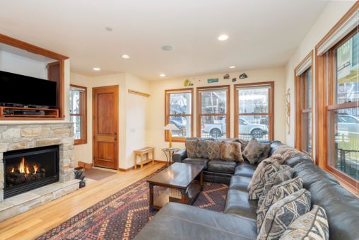 Cozy up to the warm fireplace after a long day, creating a perfect family-friendly gathering spot