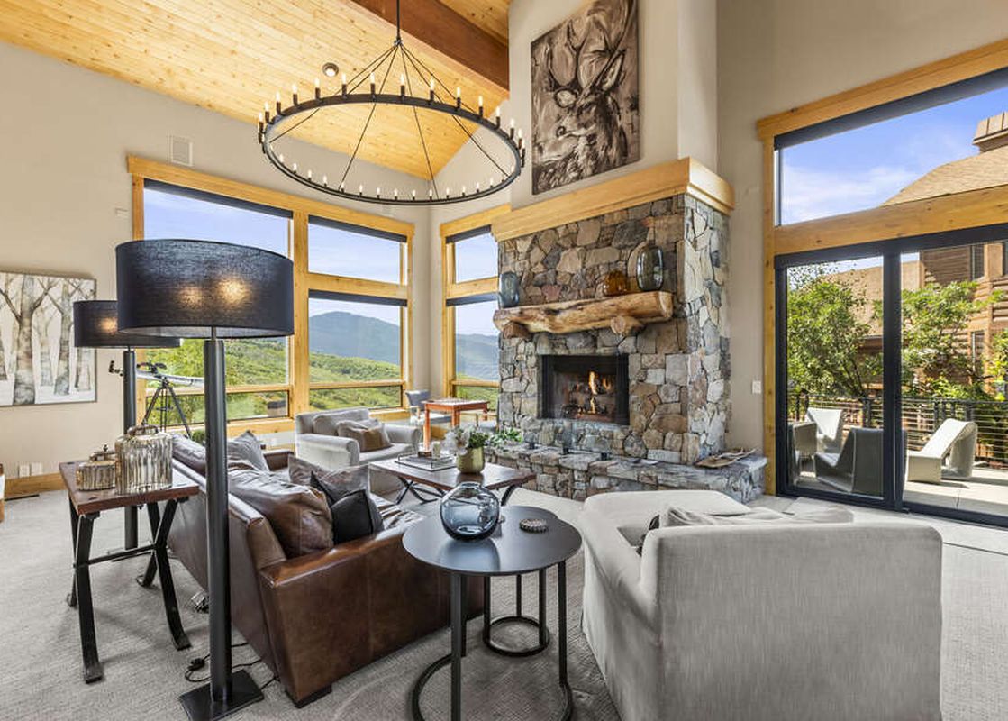 An inviting living room boasts natural light and luxury furnishings.