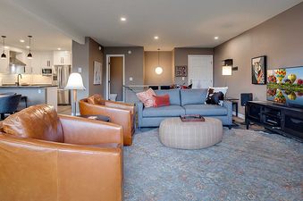 A wide view of the open-concept living and kitchen area at Ranch at Steamboat RA511, featuring comfortable seating and modern amenities.