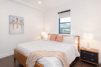 Cozy bedroom with a king-size bed and modern mountain decor at Alpine Proper.