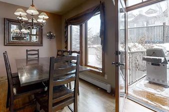 EagleRidge Townhomes 1516 kitchen featuring a dining table and chairs.