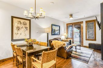 Dining and living space within BlueSky Breckenridge 409.