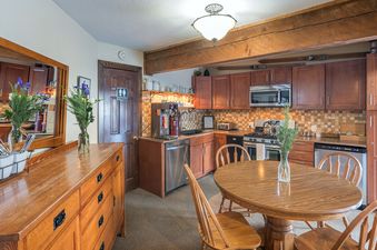 The Manitou Lodge 1 Hotel Room Bronze Rated features a cozy kitchen and dining area.