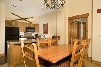 Dining table and kitchen counter in the Mountain Thunder 2 Bedroom Condo.