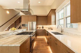 A modern kitchen at Park City Woodside Escape with sleek wooden cabinetry and premium appliances.