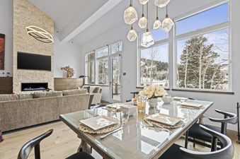 Dining table at Abode at Little Belle 3 set for a meal.