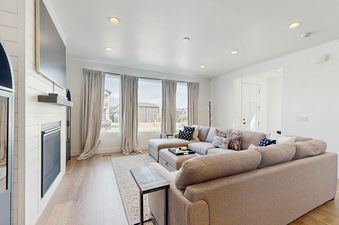 Living area in Silver Creek Retreat with sectional sofa and fireplace.