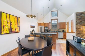 The dining area and kitchen in Owl Meadows 16 are open and inviting.