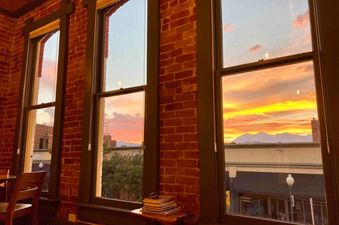 Sunny Downtown Condo above the Coffee Shop has a beautiful view of the mountains in the distance.