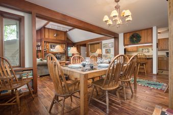 Dining area in Teewinot C5 featuring a large wooden dining table set for guests.