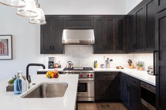 The fully equipped kitchen of Moonlight Basin 12 Wildwood features modern appliances and a large island.