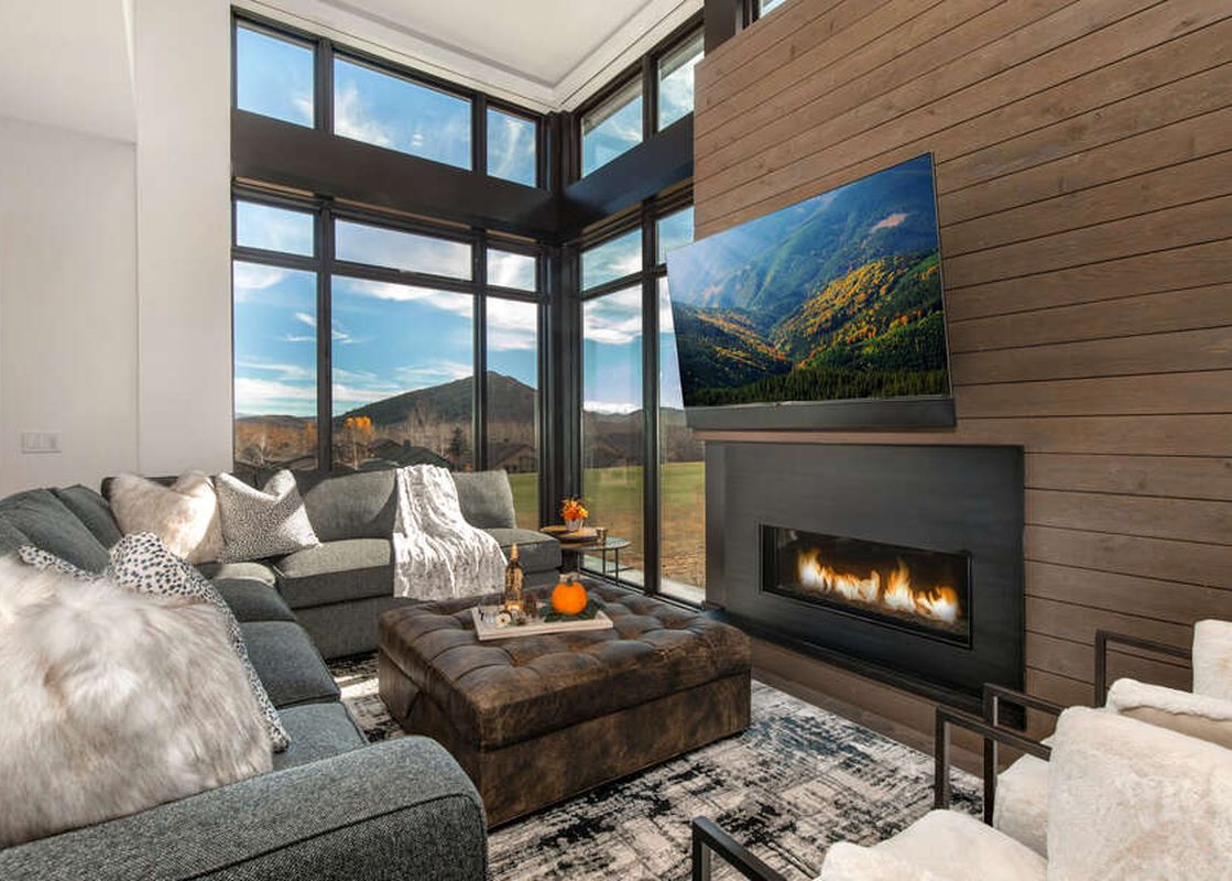 The Abode at Viridian's lounge area boasts a cozy fireplace and stunning views.