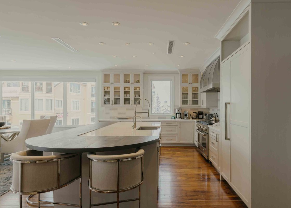 The contemporary kitchen in the Sanctuary Chalet at One Beaver Creek, featuring modern appliances and a stylish breakfast bar.