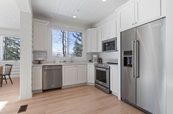 The kitchen area in Black Bear 101 features modern appliances and ample natural light.