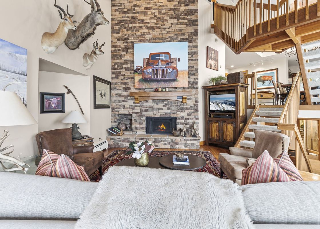 A beautifully decorated living area at Abode at Highpoint with warm and inviting decor.