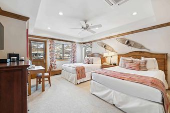 Bedroom featuring two queen sized beds.