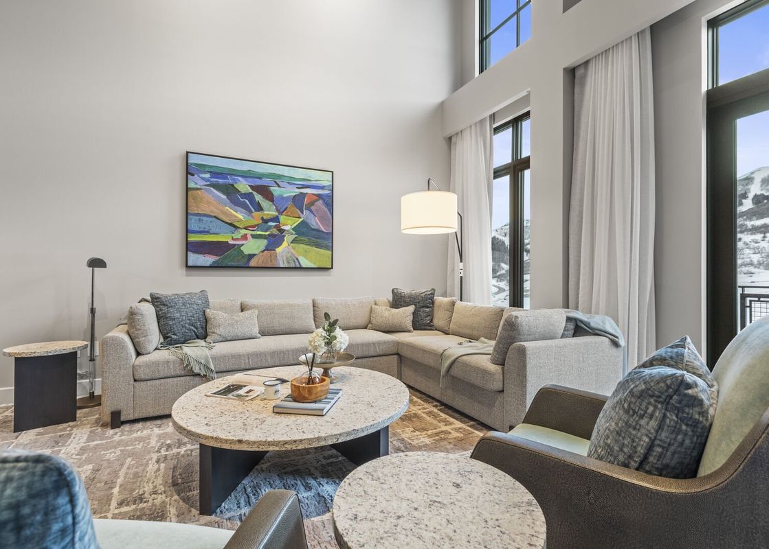 The living room at Abode at Deer Valley East is well-lit and spacious.