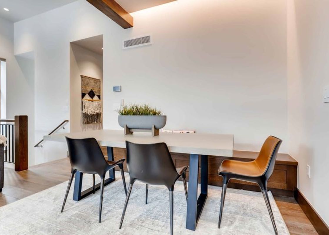 The dining area at Riverfront Townhome 13 is bright and modern.