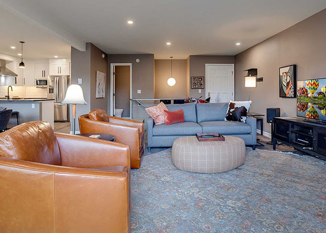 A wide view of the open-concept living and kitchen area at Ranch at Steamboat RA511, featuring comfortable seating and modern amenities.