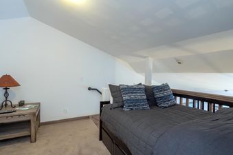 The cozy loft bedroom at Penthouse At The Peaks 826 is the perfect place to rest after a long day.