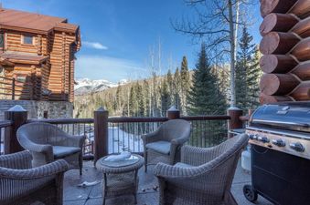 Enjoy outdoor living on the deck of Townhomes on the Creek 139 with mountain views.