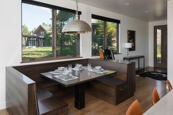 Moonlight Basin 6 Silver Peaks dining area with a large table and bench seating