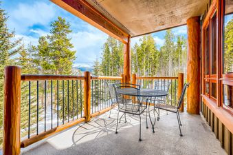 Enjoy mountain views from the private balcony of BlueSky Breckenridge 513, complete with outdoor dining furniture.