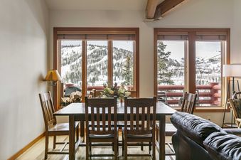 Dining area at Enclave 11 with mountain views.