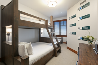The bunk beds are in the bedroom of Grand Lodge Three Bedroom Deluxe 408.