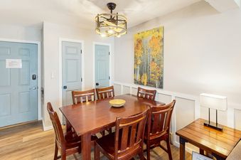 Dining area at Shadow Run E303 with wood table and chairs.