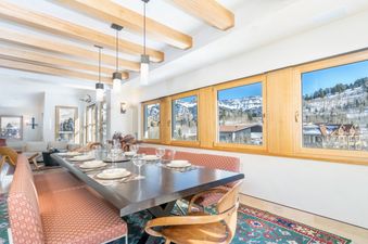 The dining area in Peaks Penthouse 851 offers a luxurious space for meals with views.