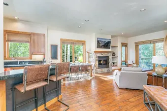Open plan living, dining, and kitchen area at Sunshine at the terraces.
